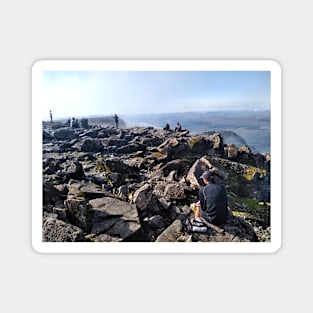 Climbers rest at the summit of Ben Nevis Magnet