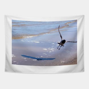 Grey crow, flying off above the water Tapestry