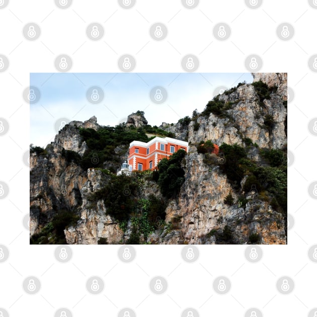 View of a red and white building with lighthouse perching on a cliff in the Amalfi coast by KristinaDrozd