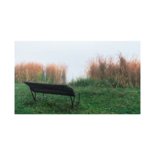 Wooden bench near a misty lake T-Shirt