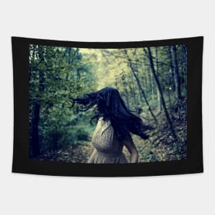 Scared girl running in the forest Tapestry