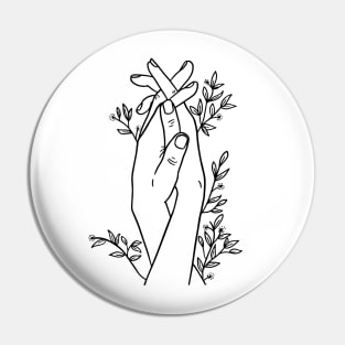 Hands holding flowers Pin