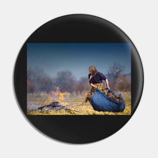 Senior rural woman burning fallen leaves Pin