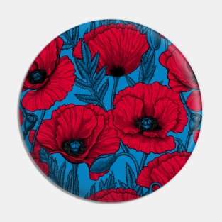 Red poppy garden on blue Pin