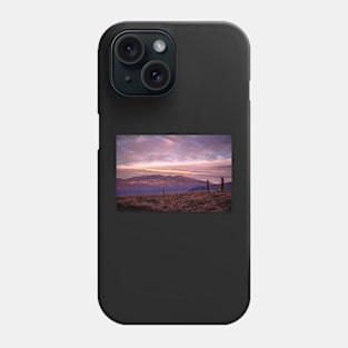 Hilly countryside at sunset Phone Case