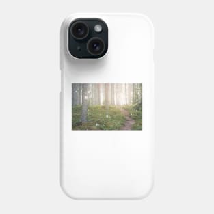 Snow falling in forest at spring day Phone Case