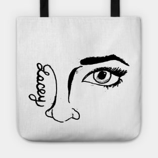 "The Face Sells" in black print Tote