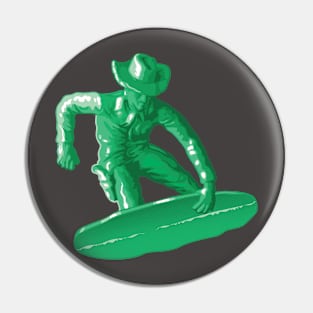 Green plastic toy snowboarding Pin