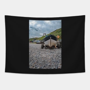 Front end view of fishing boat on the beach Tapestry