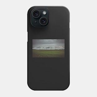 Moody sky over meadow and power lines Phone Case