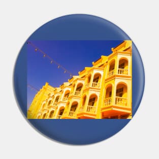 Yellow ancient floored facade against blue sky Pin