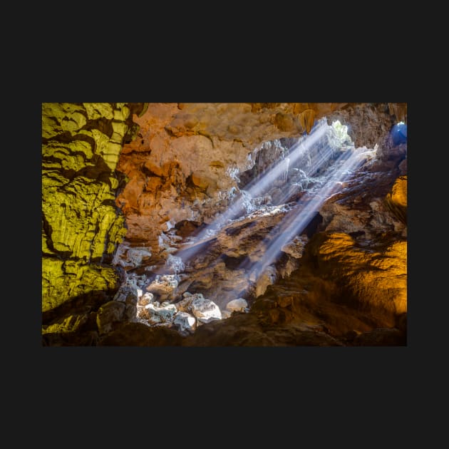 Sun rays shine through ceiling hole in Dau Go cave in Halong Bay, Vietnam by auradius