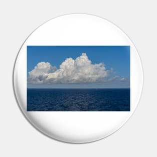 White cumulus clouds in sky over blue Baltic sea Pin