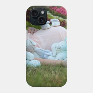 pregnant woman in the park surrounded by stuffed toys Phone Case