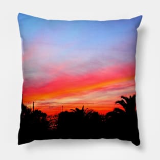 Stunning red purple sunset over a coastal town Pillow