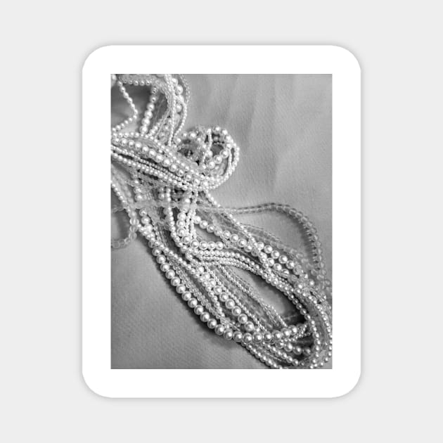 Pearls and beads on a black and white background Magnet by Kim-Pratt