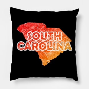 Colorful mandala art map of South Carolina with text in red and orange Pillow