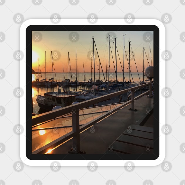 Peaceful sunset over marina with sailboat mast on Baltic sea in Langballig yachting harbor, Schleswig- Flensburg, Germany Magnet by Khala