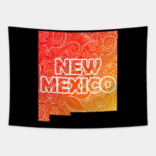 Colorful mandala art map of New Mexico with text in red and orange Tapestry