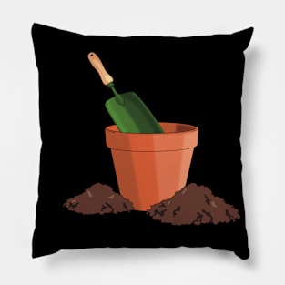 Garden terracotta pot with green mini spade and soil piles around Pillow