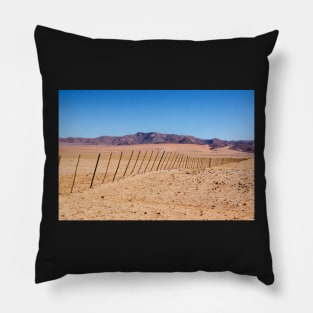 Fence across the desert. Pillow