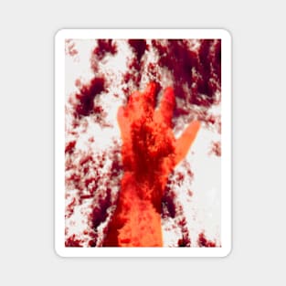 Digital collage and special processing. Psychedelic. Hand reaching on top of some bizarre surface. White, red and orange. Magnet