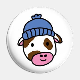 Cute cartoon dairy cow wearing a wooly hat Pin