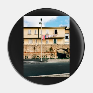 Yellow Residential Building in Italy With Drying Laundry on Washing Line Pin