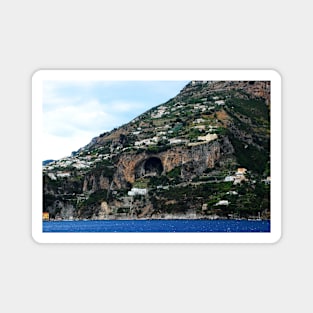 Panorama in Amalfi coast with a mountain scattered with buildings and a huge cavern in the middle Magnet