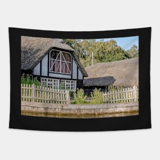 Traditional riverside cottage with thatched roof Tapestry