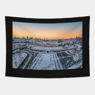 Warsaw Royal Castle, snow-covered roofs and and distant city center at dusk Tapestry