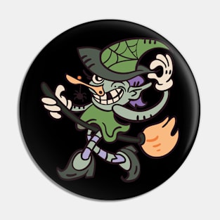 Comic witch rides on a broom Pin