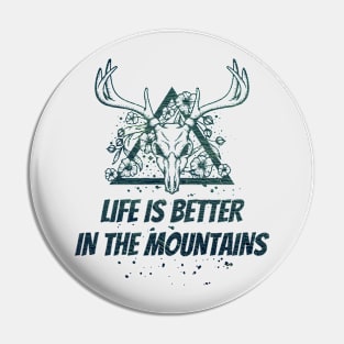 LIFE IS BETTER IN THE MOUNTAINS Dead Deer Skull Triangle With Flowers With Dark Green Forest Colors Pin