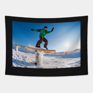 Snowboarder sliding on a rail Tapestry