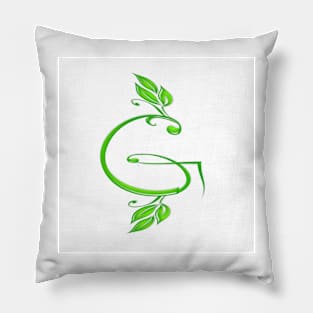 A letter G formed with leaves. Pillow