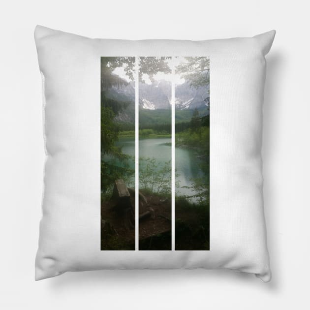 A static shot from the shore of Fusine lake in the Julian Alps with snowy mountains in background and a bench. Beautiful nature in a spring cloudy day; no people around. Italy (vertical) Pillow by fabbroni-art