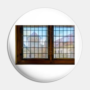 Ruins and tower of castle through vintage stained-glass window Pin