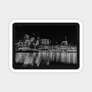 City at night, buildings, lights and corporate brands neon signs across Yarra River in monochrome Magnet