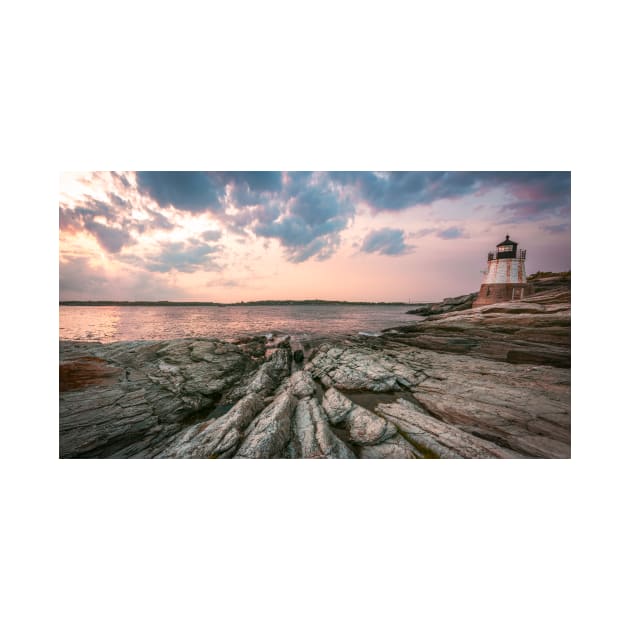 Lighthouse on a rocky beach by jswolfphoto