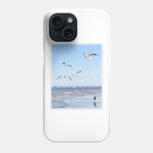 Flock of seagulls flying above the water Phone Case