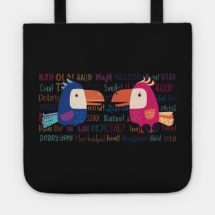 The Two colorful funny parrots meeting for a gossip surrounded with the word Hello in different languages and colors Tote