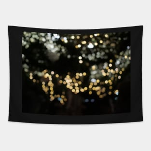 Christmas golden lights. Background of bright glow bokeh Tapestry