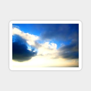Blue sky covered with dark and light clouds Magnet