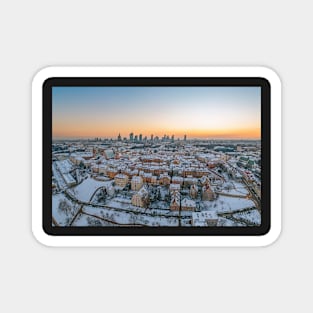 Warsaw old town, snow-covered roofs and and distant city center Magnet