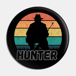 A hunter with a rifle Pin