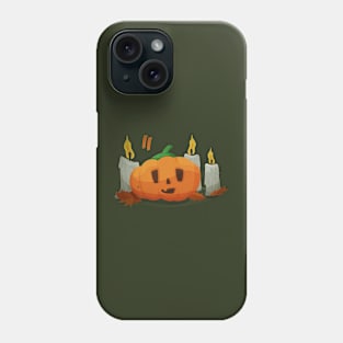 Halloween pumpkin with a face next to burning candles Phone Case