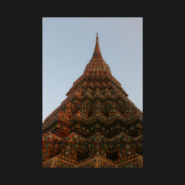 First low angle view of a Buddha stupa reaching symmetrical in the clear sky. by kall3bu