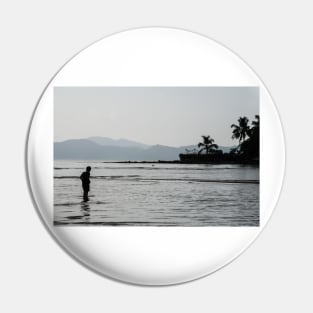 Boy walking through water in low tide Pin