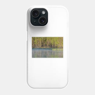 Forest reflecting to small lake at morning Phone Case