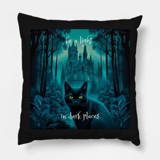 Black cat in front of Gothic cathederal with the quote "be a light in dark places". Pillow